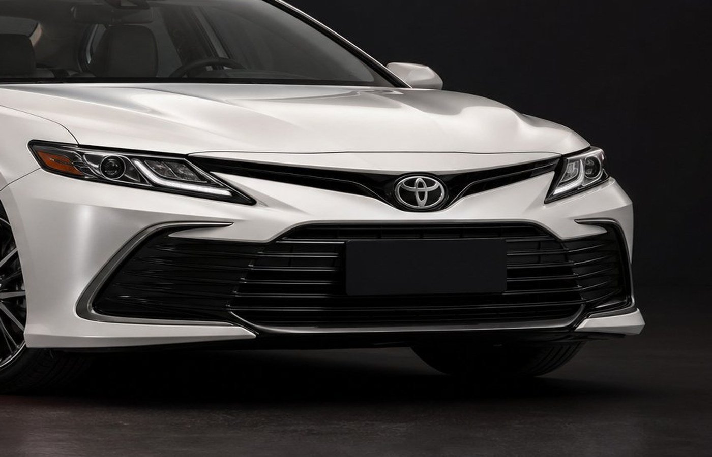 Front view of a freshly detailed white sedan