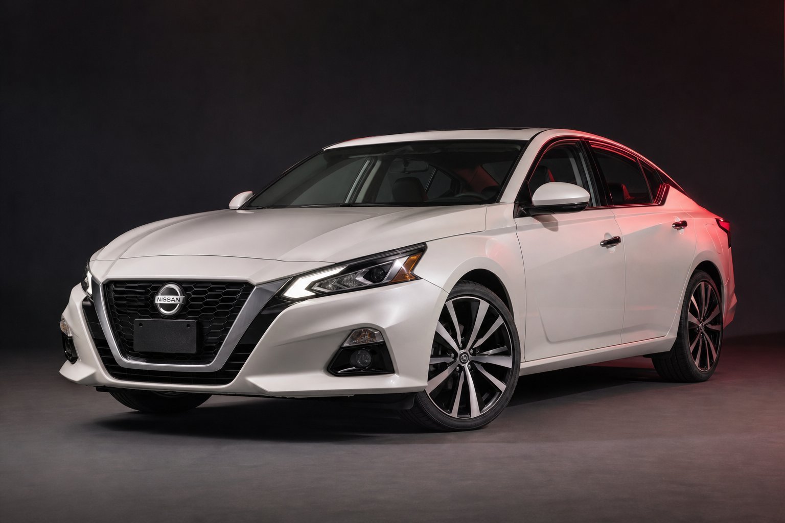 Pearl white Nissan Altima sedan