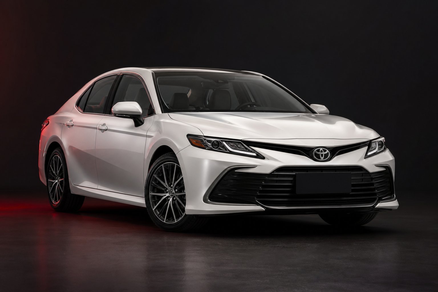 Pearl white Toyota Camry sedan