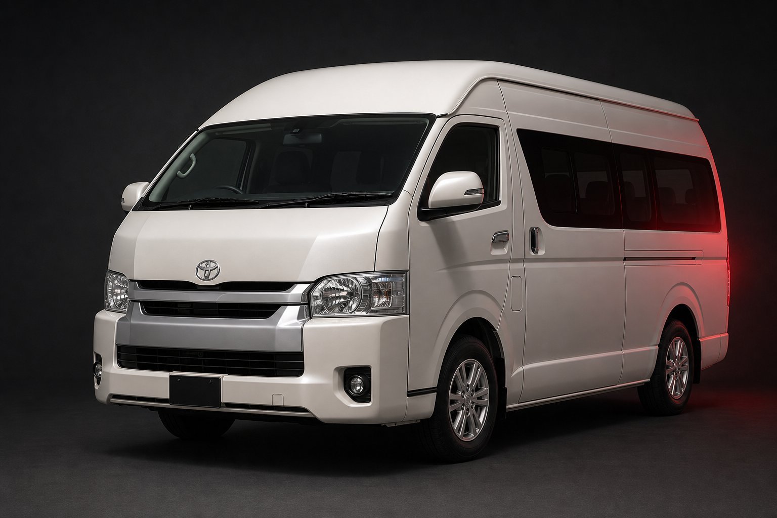 Pearl white Toyota HiAce passenger van